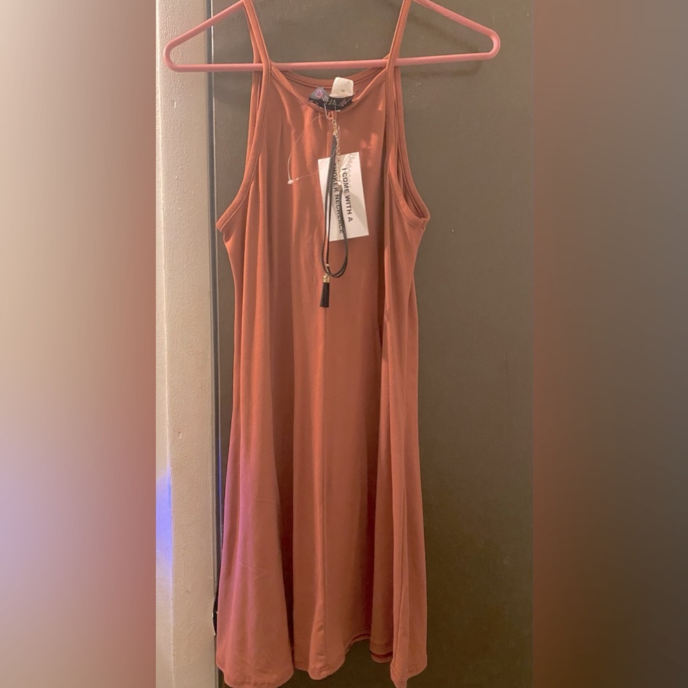 very casual and flowy dress. Knee length. Come with a very cute choker necklace.